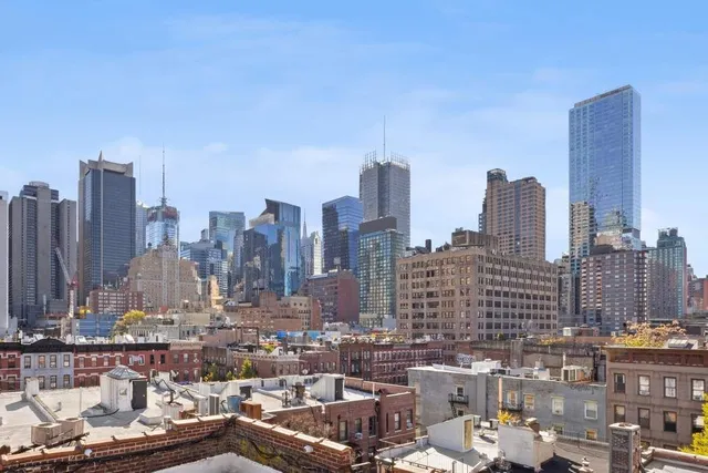 a view of a city with tall buildings