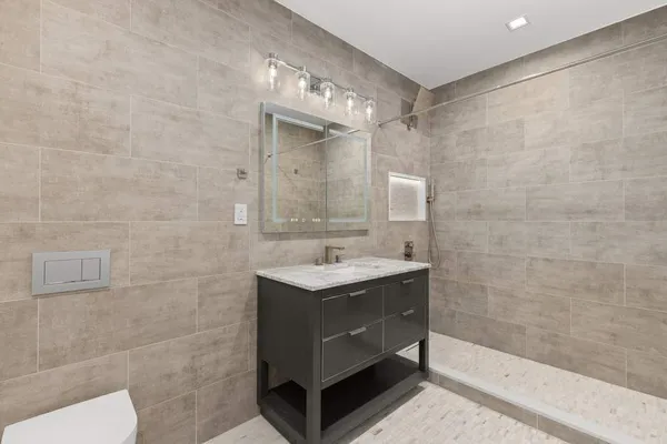 an empty room with windows and closet