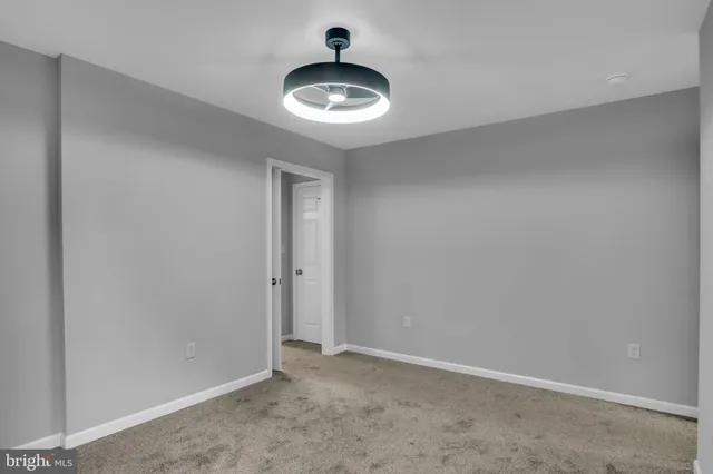 a view of a hallway with a wooden door