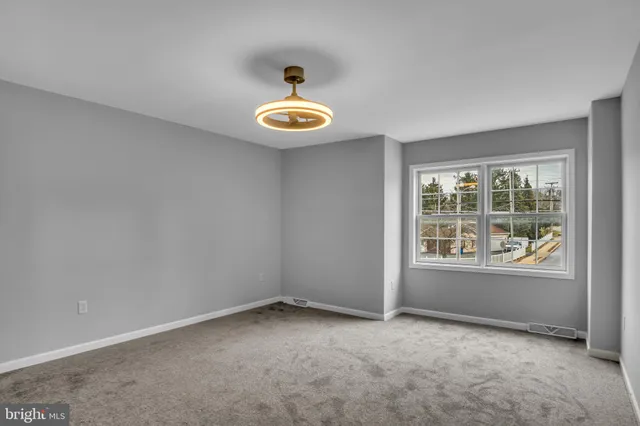 a view of an empty room and window