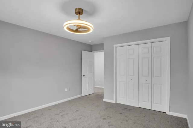 a view of an empty room with wooden walls