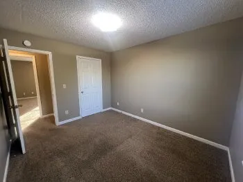 an empty room with sliding door