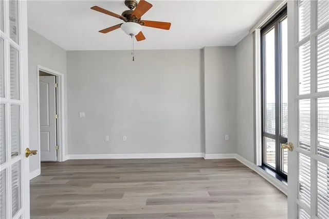 wooden floor in an empty room with a window
