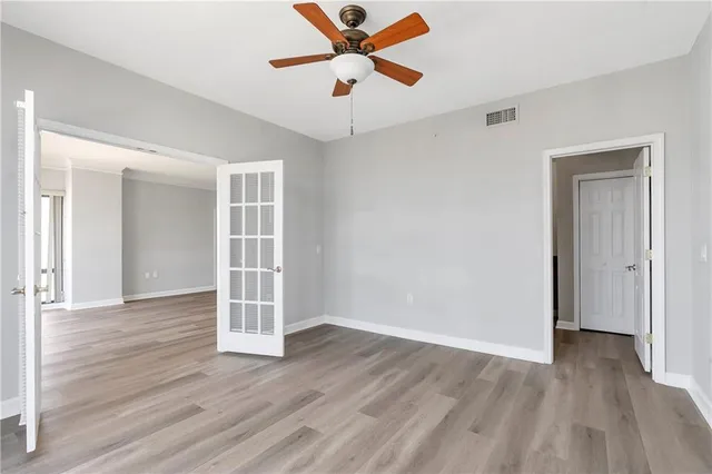 a view of a room with rack and wooden cabinet