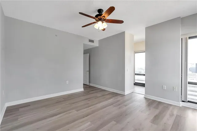 a spacious bathroom with a shower sink and mirror