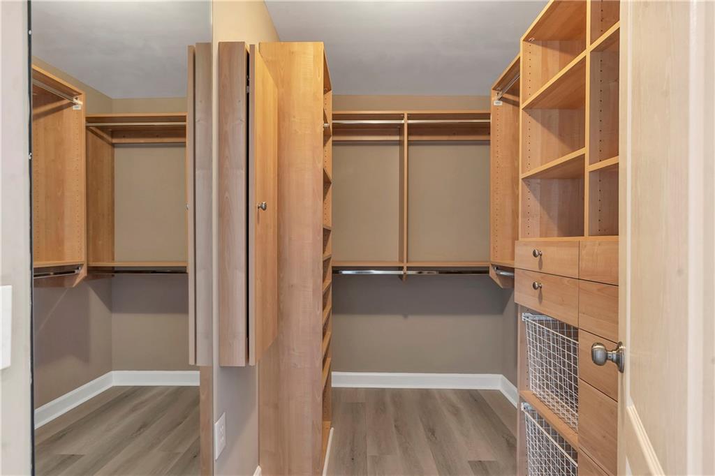 3475 Oak Valley Road Northeast, Unit 1930 Atlanta, GA 30326 - Photo 22 of 29 a view of walk in closet with empty racks