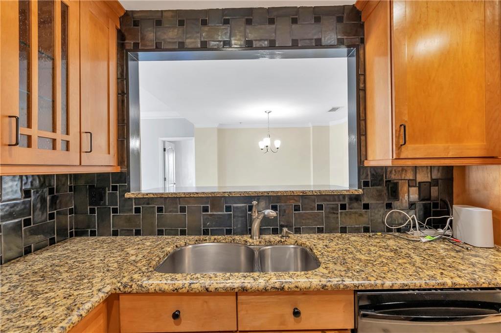 3475 Oak Valley Road Northeast, Unit 1930 Atlanta, GA 30326 - Photo 28 of 29 a kitchen with a sink and cabinets