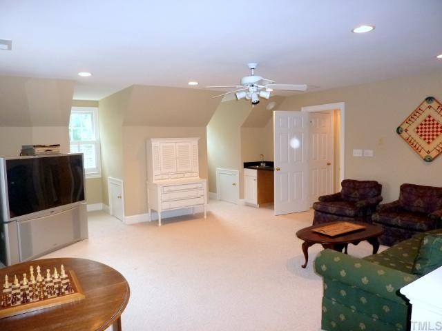 4617 White Chapel Way Raleigh, NC 27615 - Photo 10 of 12 a living room with furniture and a flat screen tv