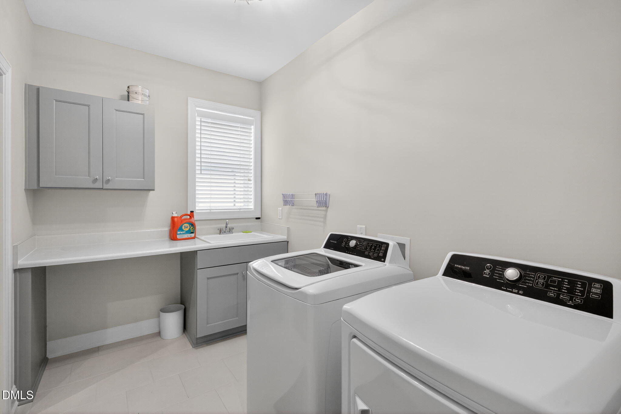 6901 Ray Family Farm Court Raleigh, NC 27613 - Photo 34 of 52 a utility room with dryer washer and sink