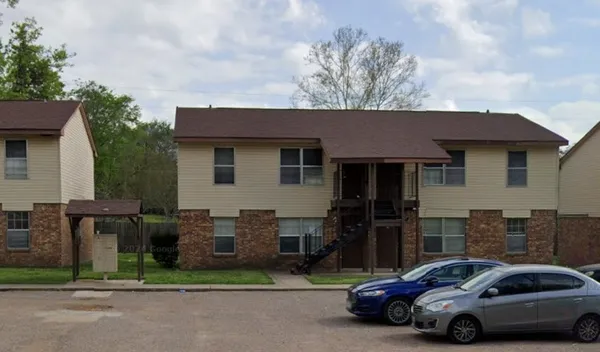 a car parked in front of a house