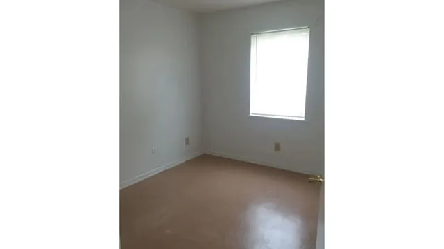a view of a room that has a window in it