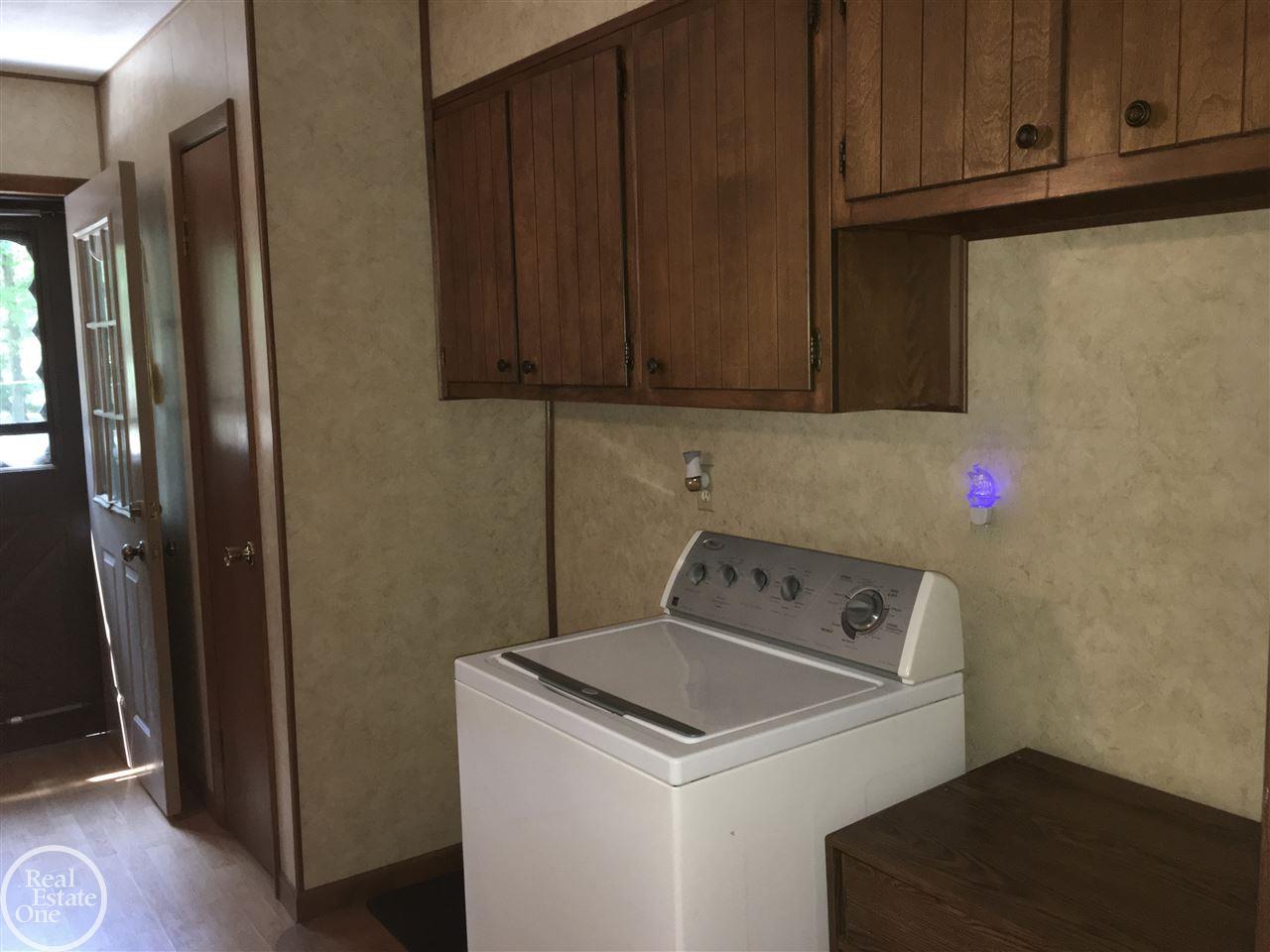 6044 Port Austin Road Caseville, MI 48725 - Photo 19 of 47 Extra cabinets and storage