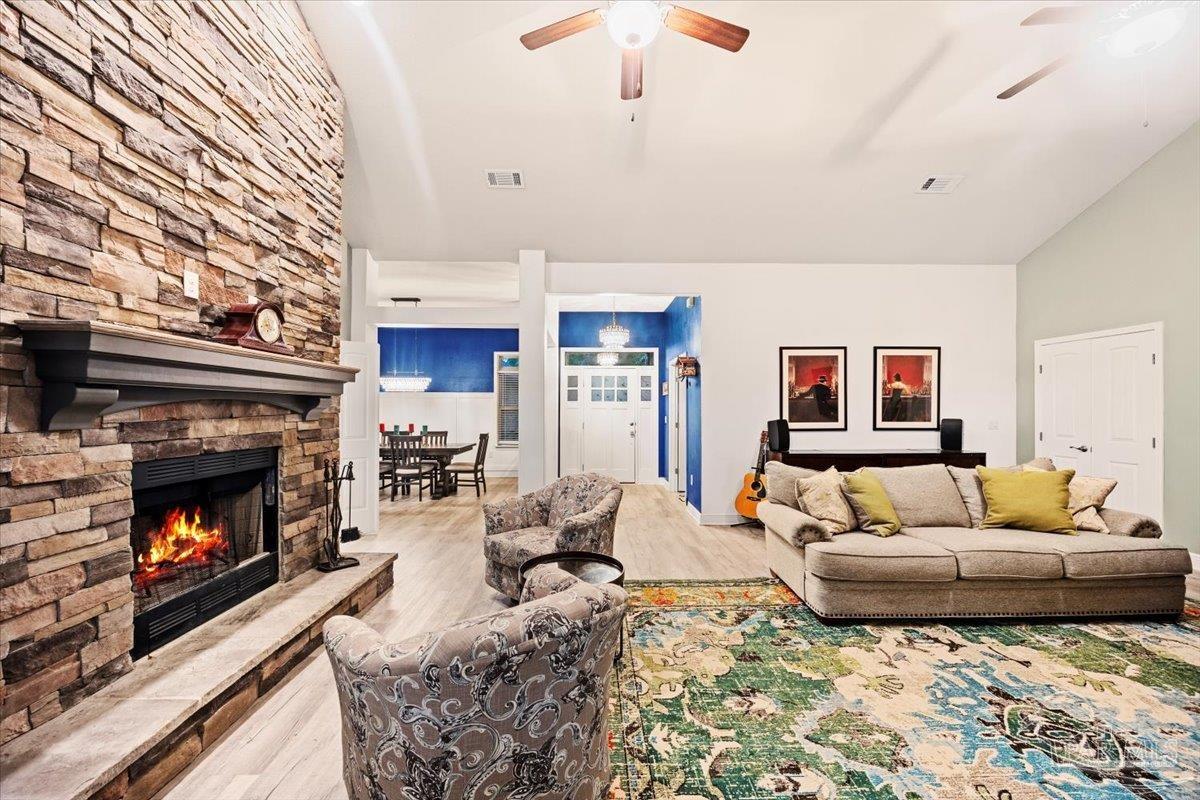 7191 Apples Way Navarre, FL 32566 - Photo 18 of 54 a living room with furniture and a fireplace