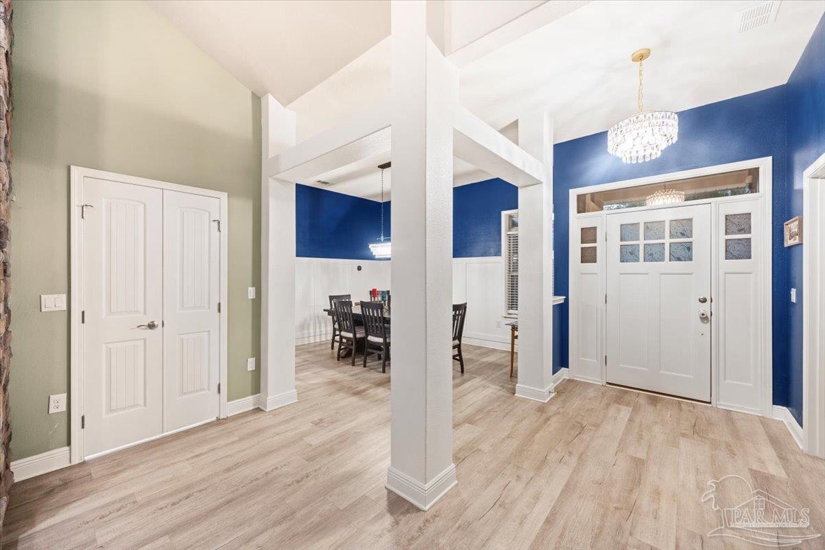7191 Apples Way Navarre, FL 32566 - Photo 20 of 54 a view of livingroom with hardwood floor and a ceiling fan