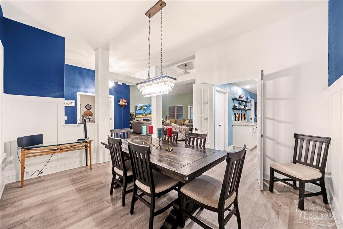 7191 Apples Way Navarre, FL 32566 - Photo 22 of 54 a view of a dining room with furniture
