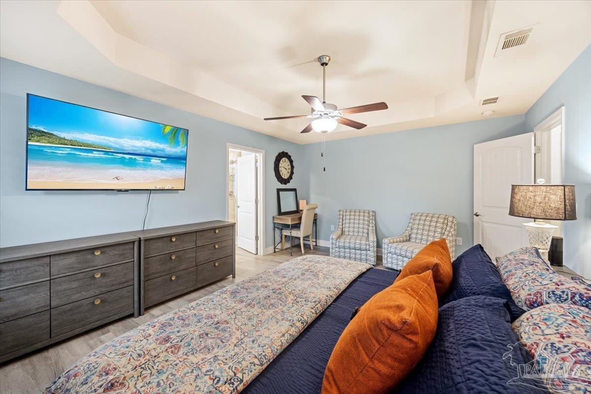 7191 Apples Way Navarre, FL 32566 - Photo 40 of 54 a living room with furniture and a chandelier