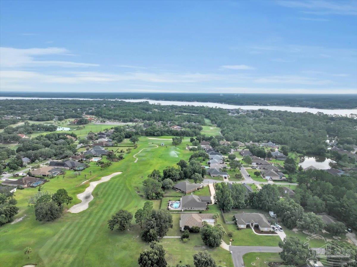 7191 Apples Way Navarre, FL 32566 - Photo 53 of 54 an aerial view of residential houses with outdoor space and trees