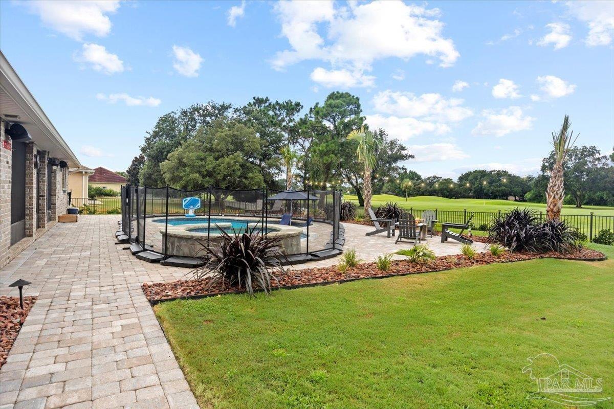 7191 Apples Way Navarre, FL 32566 - Photo 8 of 54 a view of a patio with chairs and a yard