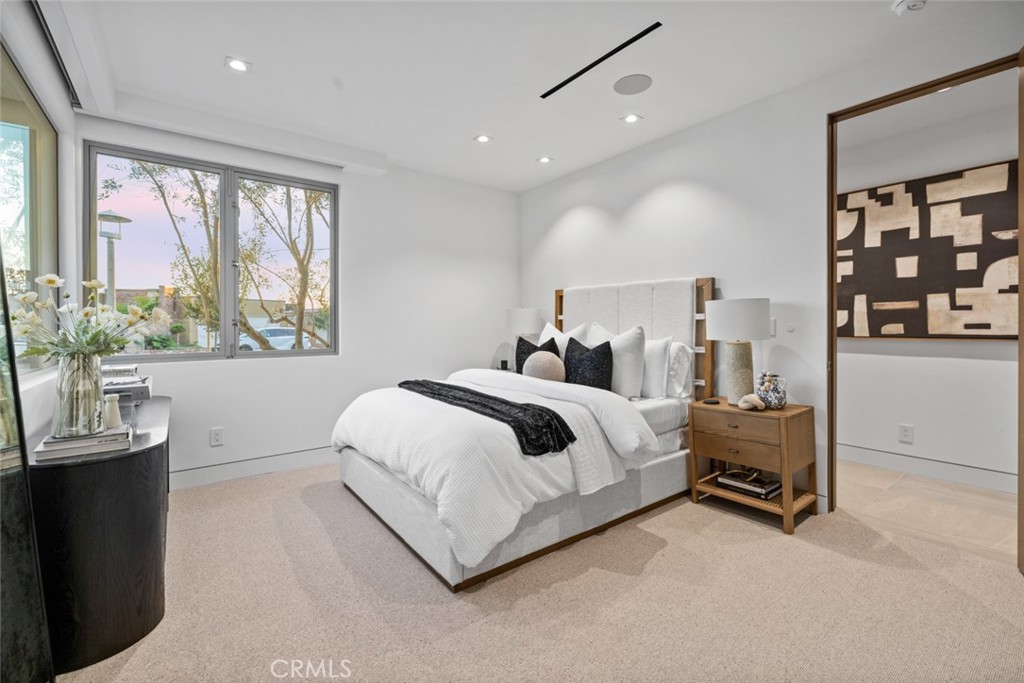 1399 Galaxy Drive Newport Beach, CA 92660 - Photo 12 of 39 a bedroom with a bed and a large window