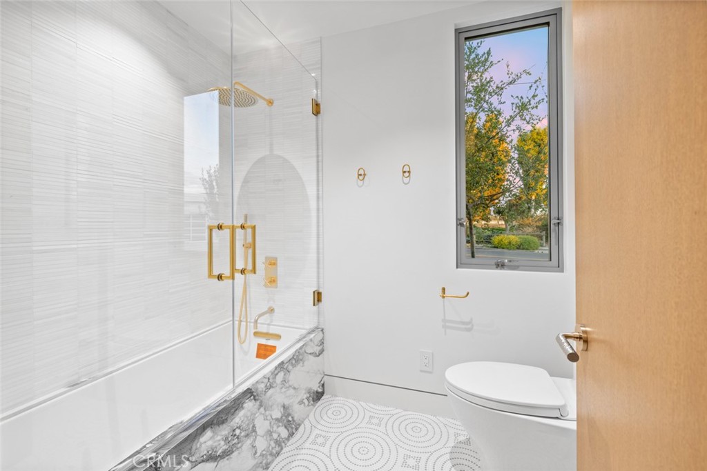 1399 Galaxy Drive Newport Beach, CA 92660 - Photo 15 of 39 a bathroom with a toilet a sink and a shower