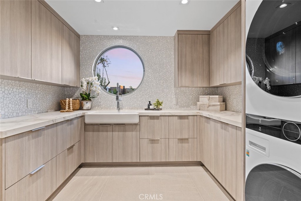 1399 Galaxy Drive Newport Beach, CA 92660 - Photo 16 of 39 a kitchen with a sink cabinets and a stove