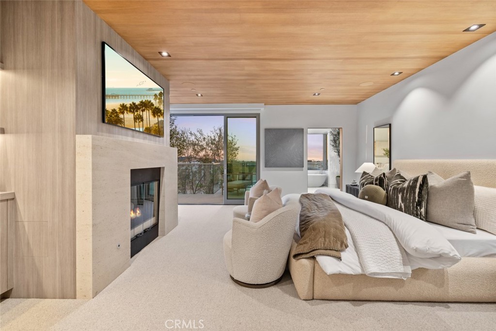 1399 Galaxy Drive Newport Beach, CA 92660 - Photo 21 of 39 a living room with furniture a fireplace and a flat screen tv