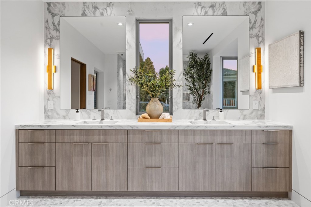 1399 Galaxy Drive Newport Beach, CA 92660 - Photo 26 of 39 a bathroom with a sink and a mirror
