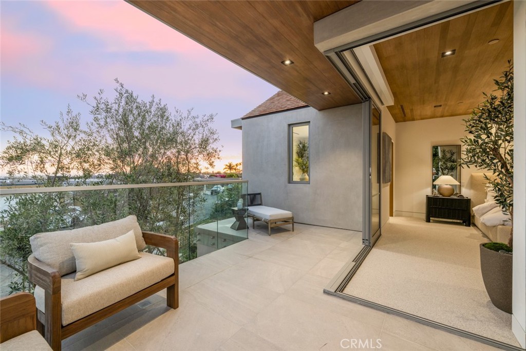 1399 Galaxy Drive Newport Beach, CA 92660 - Photo 30 of 39 a balcony with furniture and a potted plant