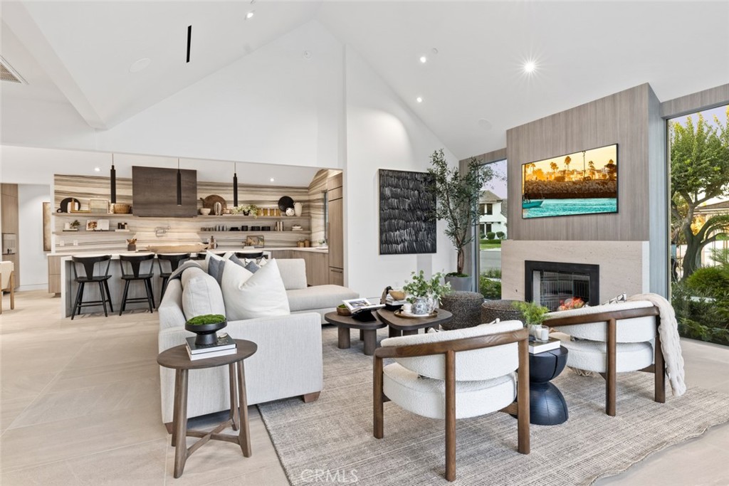 1399 Galaxy Drive Newport Beach, CA 92660 - Photo 6 of 39 a living room with furniture a rug and a fireplace