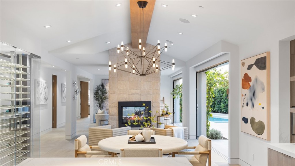 1399 Galaxy Drive Newport Beach, CA 92660 - Photo 9 of 39 a living room with furniture fireplace and a chandelier