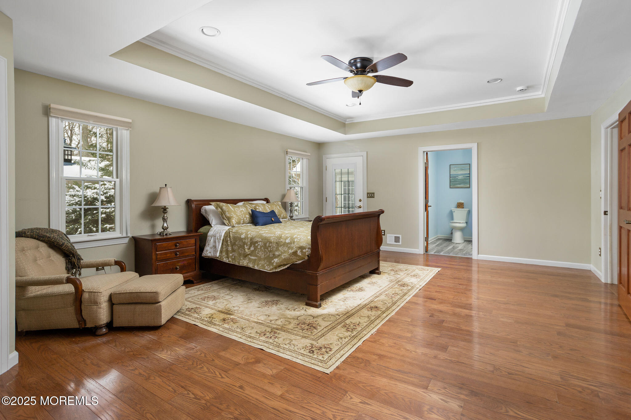 3 Tower Road Allentown, NJ 08501 - Photo 17 of 49 a spacious bedroom with a bed a couch and a chandelier