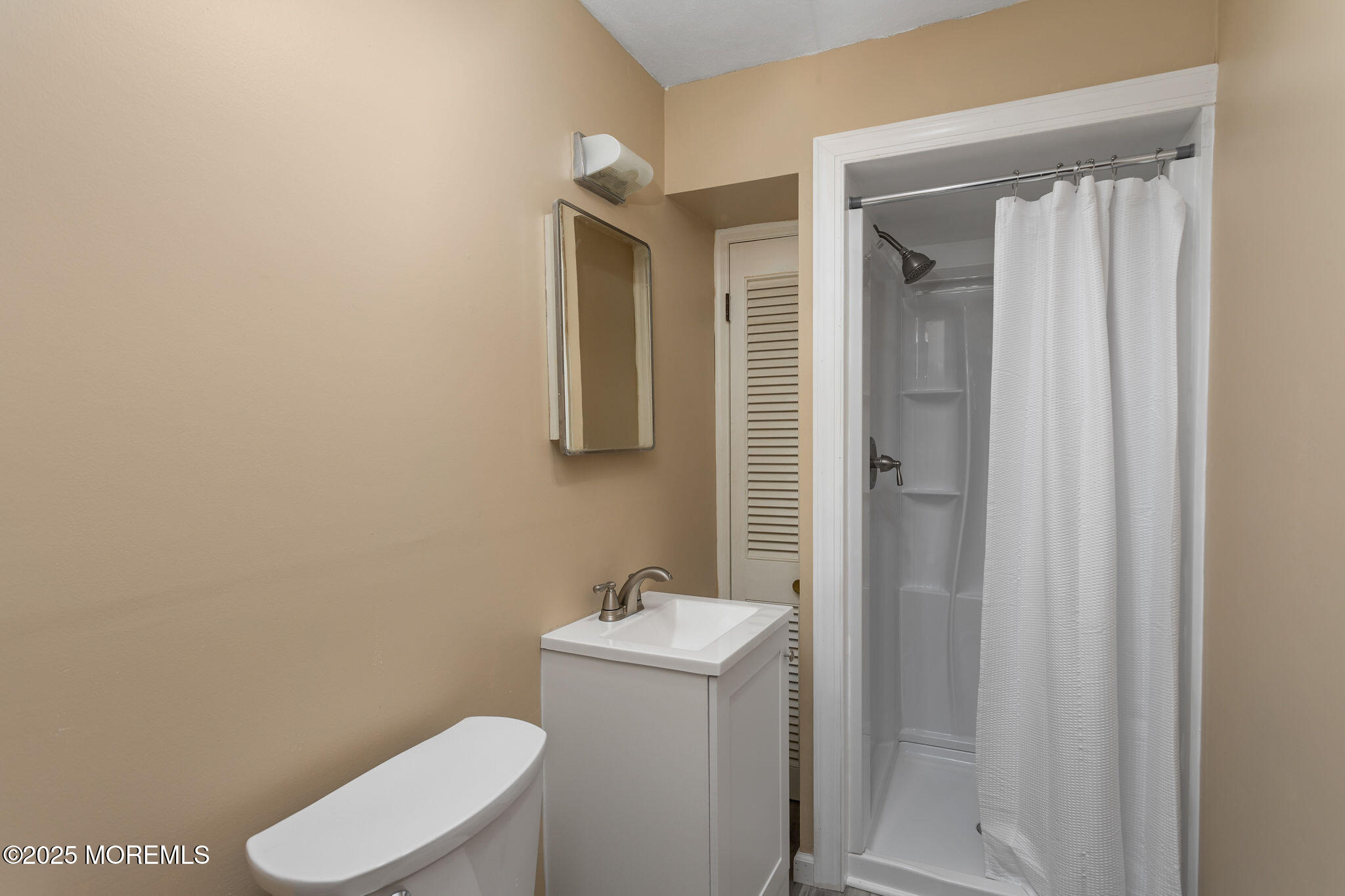 3 Tower Road Allentown, NJ 08501 - Photo 29 of 49 a bathroom with a toilet a sink and mirror