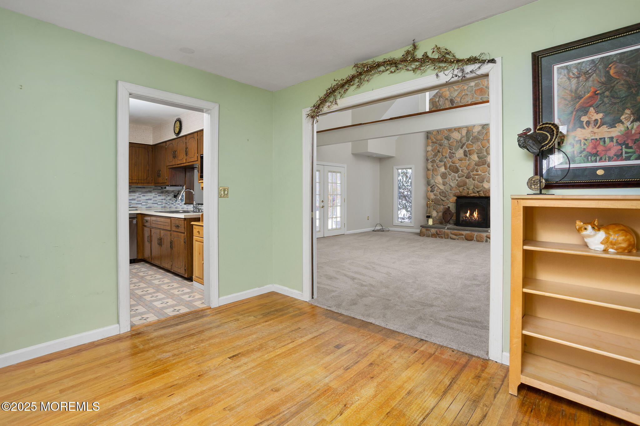 3 Tower Road Allentown, NJ 08501 - Photo 7 of 49 a view of a hallway to a livingroom with wooden floor and a bathroom