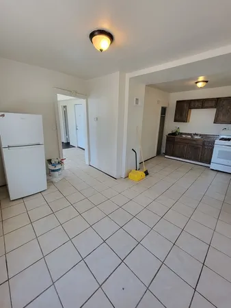 a view of a storage & utility room with a sink