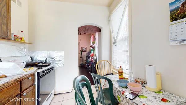 a view of a livingroom with furniture and kitchen