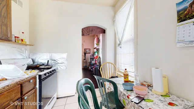 a view of a livingroom with furniture and kitchen