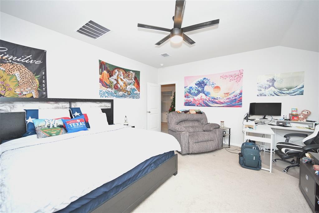 3713 Ridgeway Lane Argyle, TX 76226 - Photo 18 of 40 a bedroom with a bed and furniture