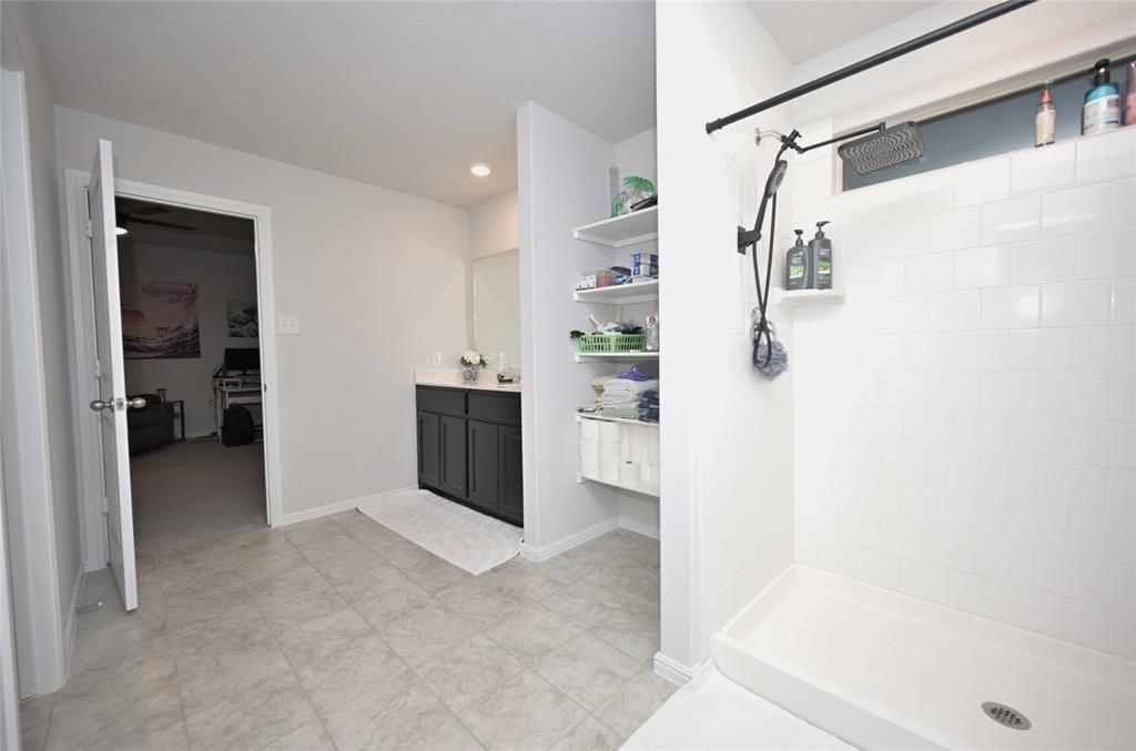 3713 Ridgeway Lane Argyle, TX 76226 - Photo 21 of 40 a view of walk in closet with clothes and shoes