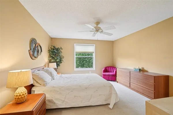 a bedroom with a bed and a couch