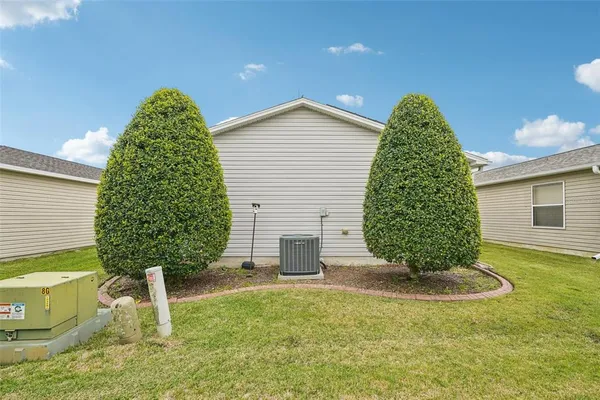 a view of a backyard of the house