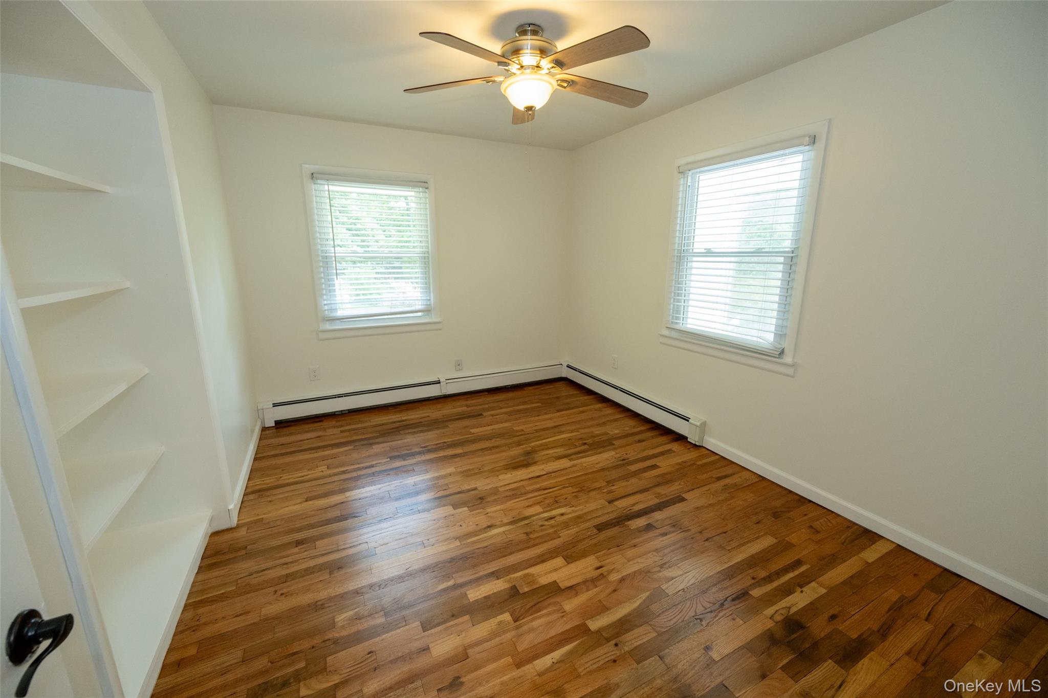 136 Foggintown Road Brewster, NY 10509 - Photo 27 of 50 wooden floor in an empty room with a window