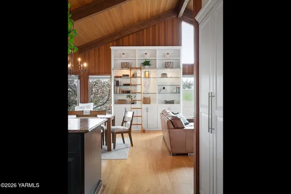 a kitchen with stainless steel appliances granite countertop a sink a stove and a refrigerator