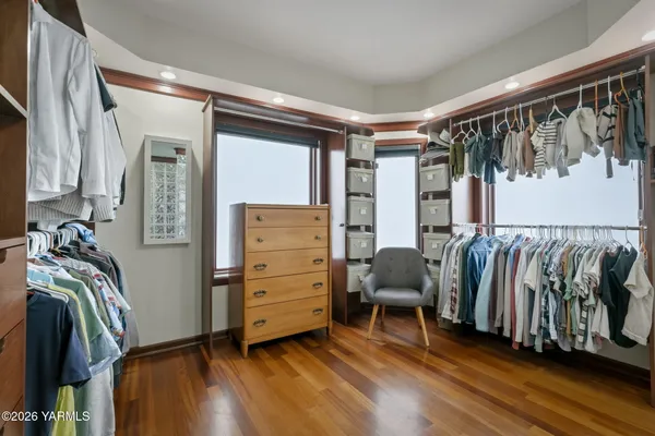 a bathroom with a double vanity sink toilet and mirror