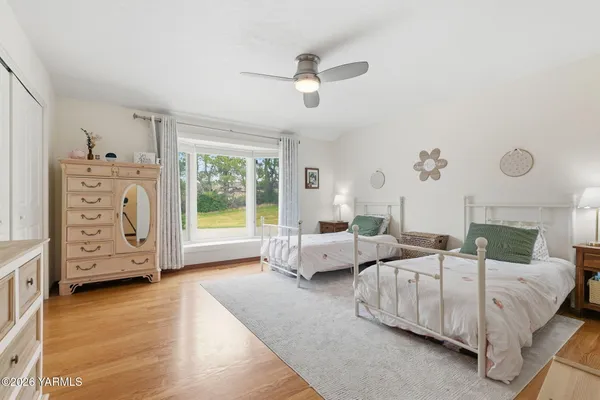 a room with lots of furniture and a rug