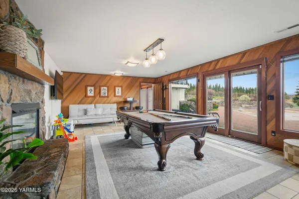 a view of balcony with wooden floor and fence