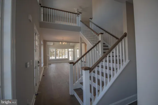 a view of staircase with railing and a stairs