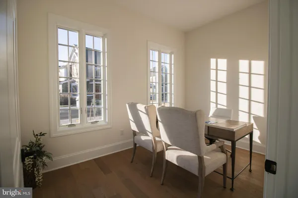 a view of a dining room with furniture and window