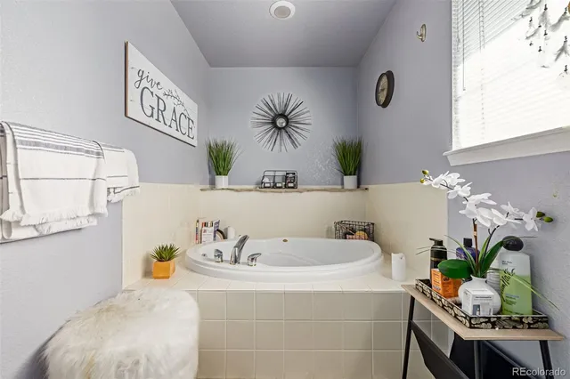 a bath room with a sink and a mirror