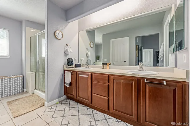 a spacious bathroom with a double vanity sink mirror and