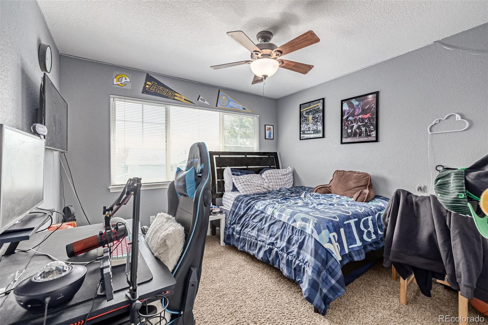 24248 East Roxbury Circle Aurora, CO 80016 - Photo 17 of 42 a bedroom with a bed window and a desk